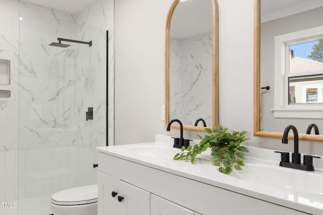 bathroom featuring toilet, walk in shower, and vanity