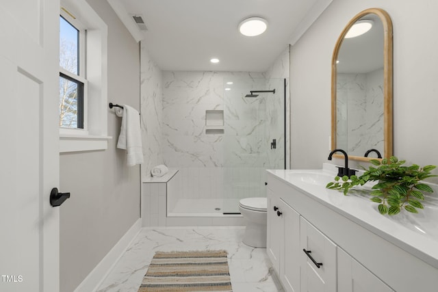 bathroom with toilet, vanity, and tiled shower