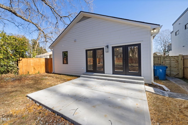 rear view of property with a patio and french doors