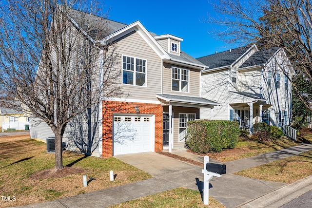 view of front of property featuring central air condition unit, a front yard, and a garage