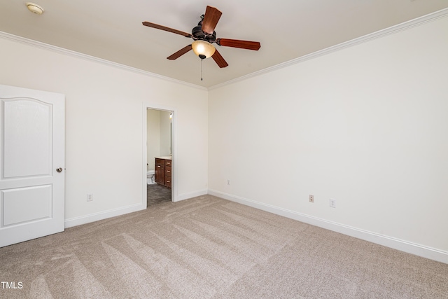 unfurnished bedroom with light colored carpet, ceiling fan, crown molding, and connected bathroom