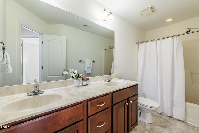 full bathroom with shower / bath combination with curtain, vanity, and toilet