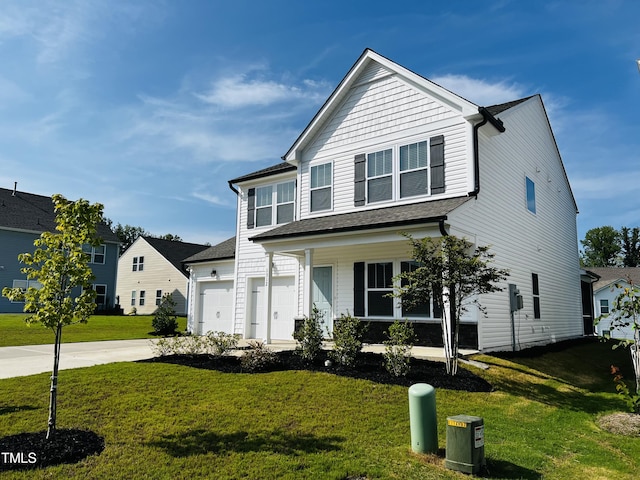 view of front of home with a garage, covered porch, and a front lawn