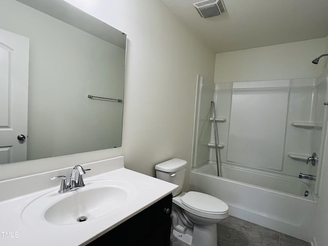 full bathroom featuring vanity, tile patterned flooring, shower / washtub combination, and toilet