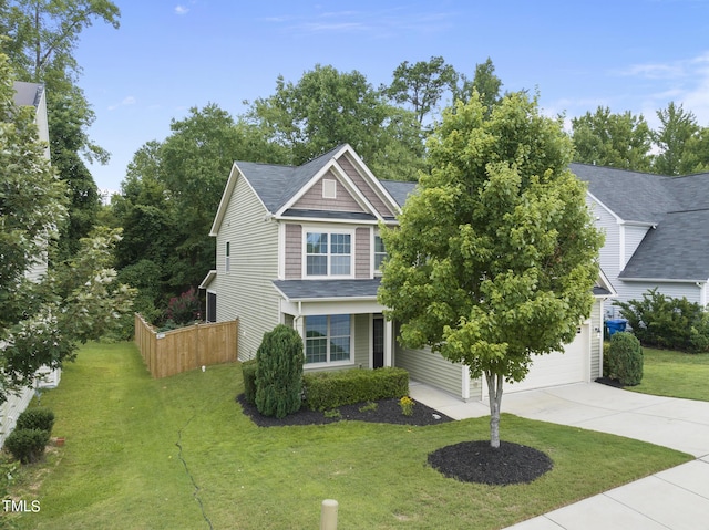 view of front of house with concrete driveway, fence, a front yard, and a shingled roof