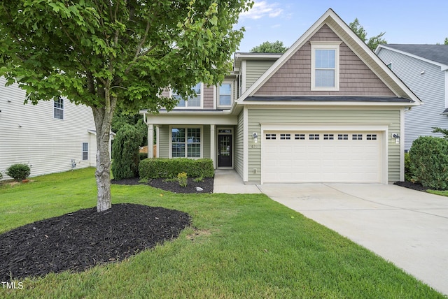 view of front of house featuring an attached garage, concrete driveway, and a front lawn