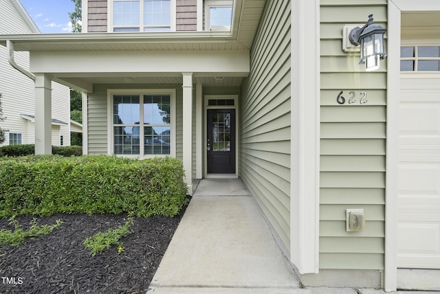 doorway to property featuring covered porch