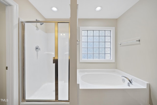 full bath featuring a garden tub, recessed lighting, and a stall shower