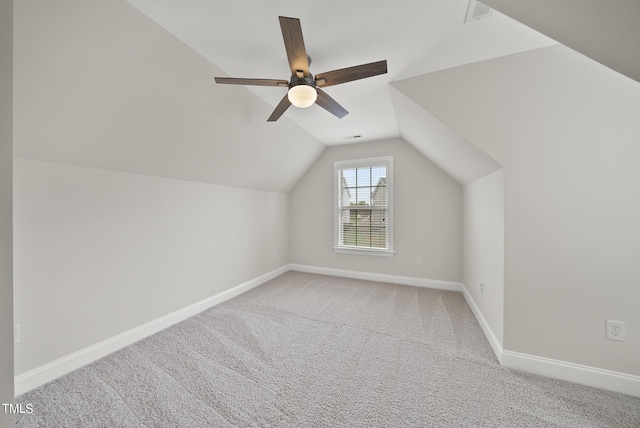 bonus room with visible vents, lofted ceiling, carpet, baseboards, and ceiling fan