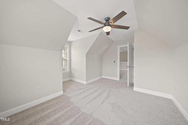 bonus room featuring visible vents, carpet, baseboards, and vaulted ceiling