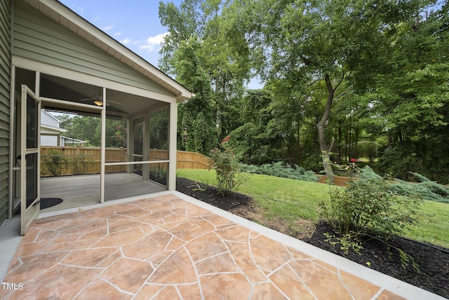 view of patio featuring a ceiling fan and fence