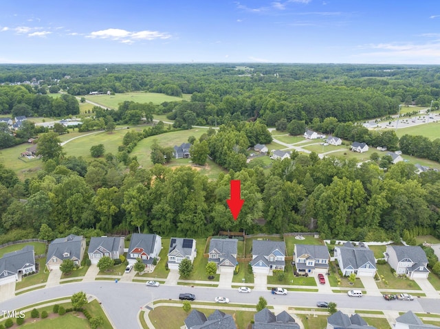 aerial view featuring a residential view and a forest view