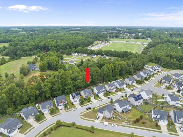 aerial view with a forest view and a residential view