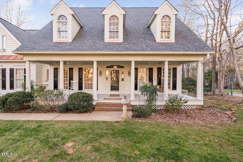 view of front facade with a front lawn and a porch