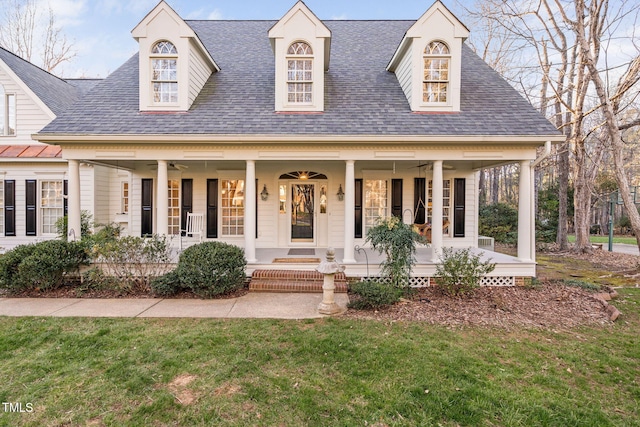 view of front facade with a front lawn and a porch