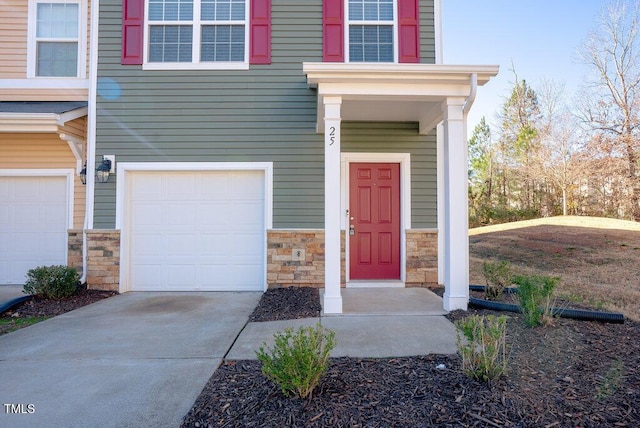 property entrance with a garage