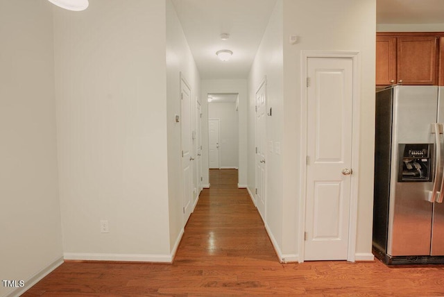 corridor featuring light hardwood / wood-style flooring