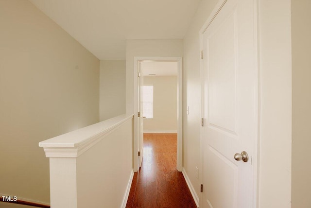 hallway with dark hardwood / wood-style flooring