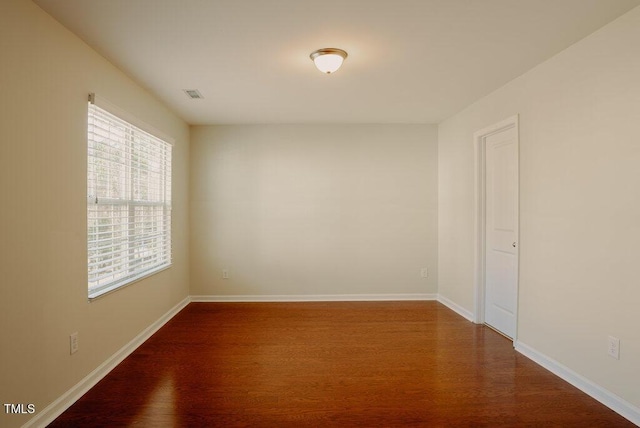 empty room featuring wood-type flooring