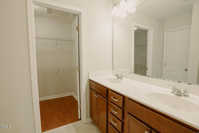 bathroom with vanity and tile patterned flooring