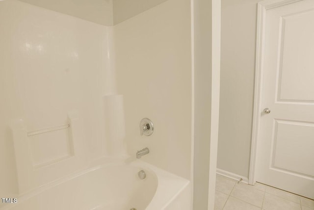 bathroom featuring tile patterned flooring and shower / bath combination