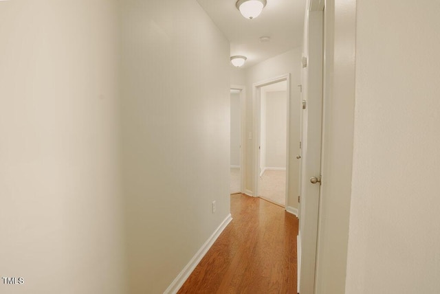 hallway with light wood-type flooring