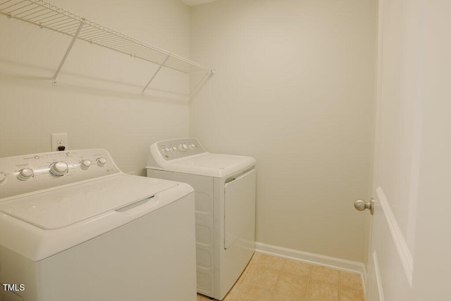 clothes washing area with washer and dryer