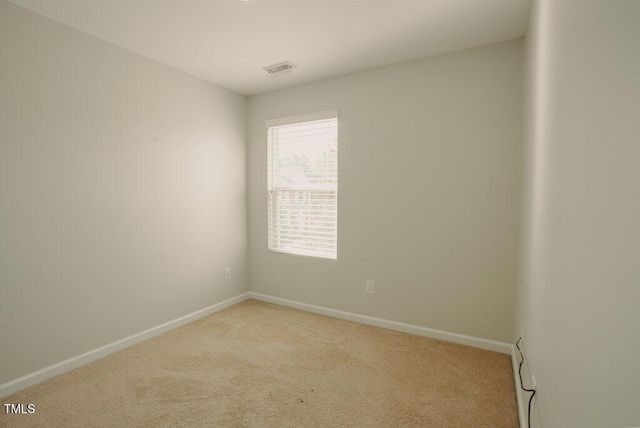 empty room featuring light colored carpet