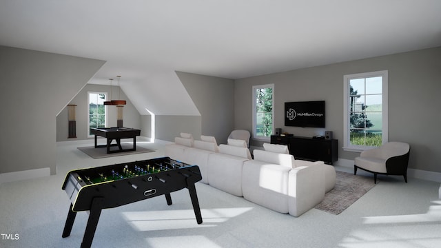 carpeted living room with vaulted ceiling and a wealth of natural light