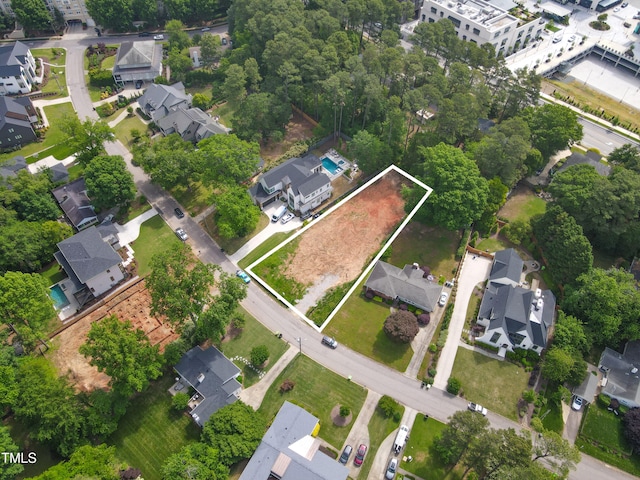 4112 Rockingham Dr, Raleigh, NC 27609 - aerial overview of property's location with nearby suburban area and property parcel outlined