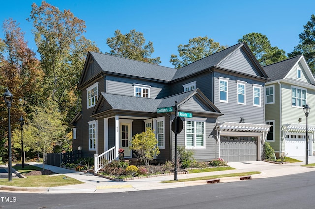 view of front of house with a pergola and a garage