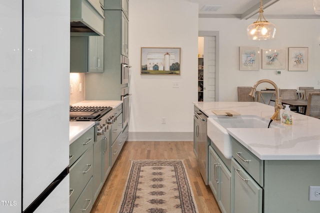 kitchen with decorative light fixtures, stainless steel appliances, custom exhaust hood, and green cabinets