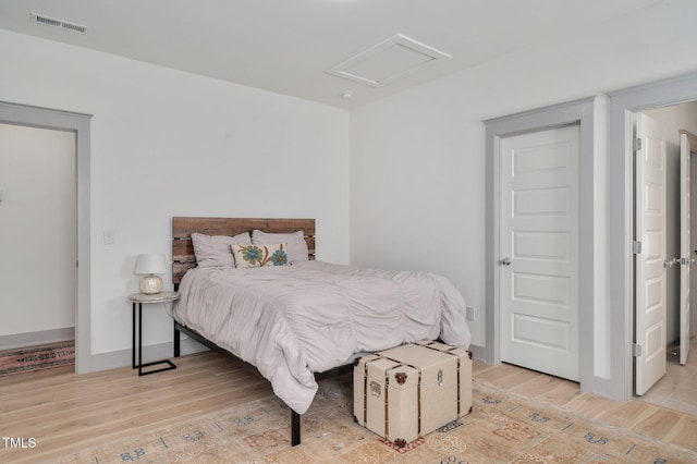 bedroom with light wood-type flooring