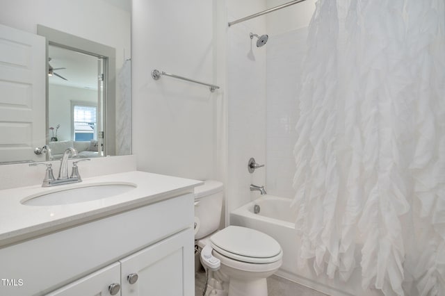 full bathroom featuring toilet, shower / bath combo with shower curtain, ceiling fan, and vanity