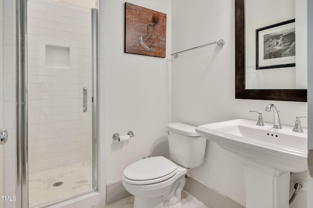 bathroom with toilet and an enclosed shower