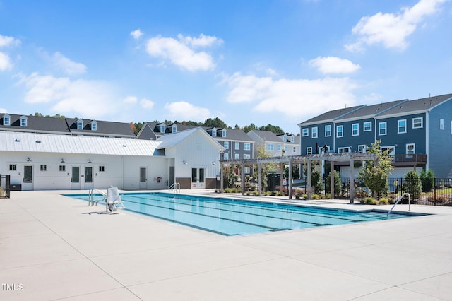 view of pool with a patio and a pergola