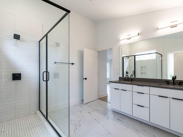 bathroom featuring an enclosed shower and vanity