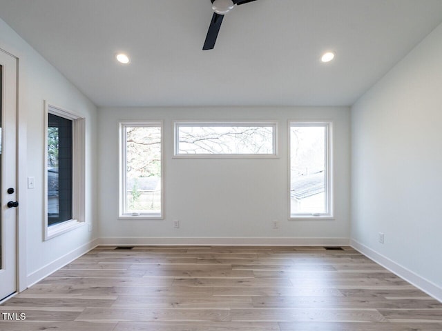 interior space with ceiling fan, light wood-type flooring, and a wealth of natural light