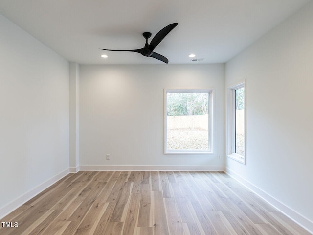 spare room featuring light wood-type flooring and ceiling fan