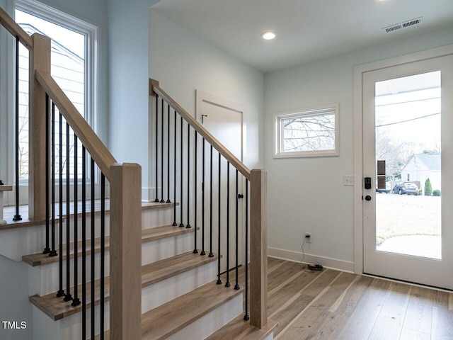 foyer featuring a healthy amount of sunlight and light hardwood / wood-style flooring