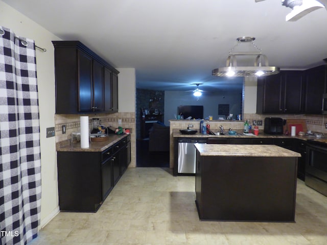 kitchen with a center island, decorative backsplash, appliances with stainless steel finishes, ceiling fan, and a peninsula