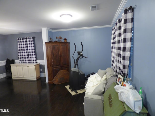 interior space with ornamental molding, dark wood-style flooring, and visible vents