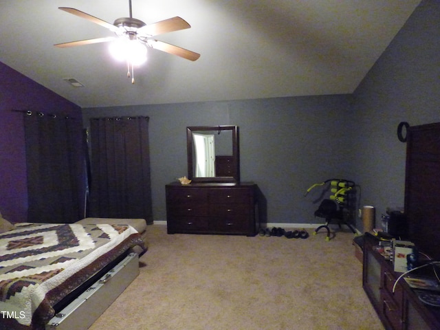 carpeted bedroom with vaulted ceiling, ceiling fan, and visible vents