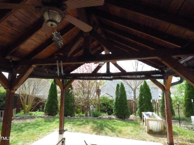 view of home's community with a gazebo, fence, and a lawn