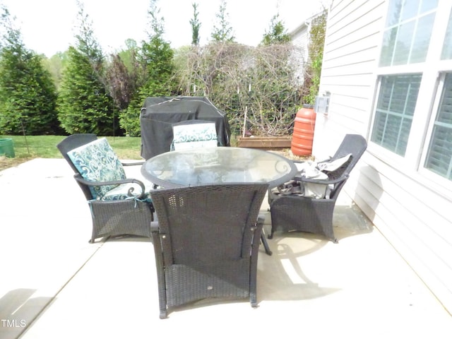view of patio / terrace with a grill and outdoor dining space