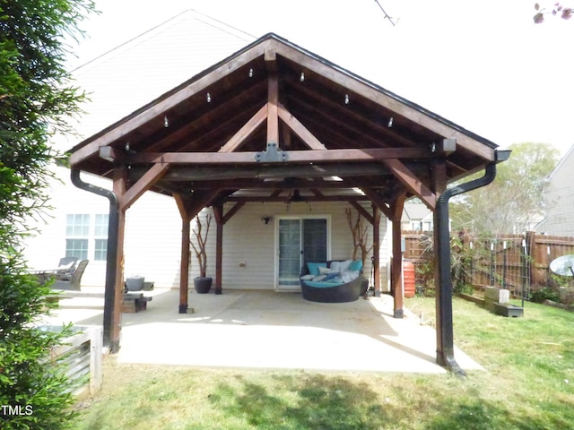 view of parking with a gazebo and fence
