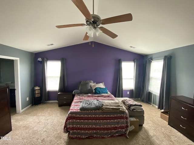 401 Lawton Dr, Haw River, NC 27258 - bedroom with light carpet, vaulted ceiling, multiple windows, ceiling fan, and baseboards