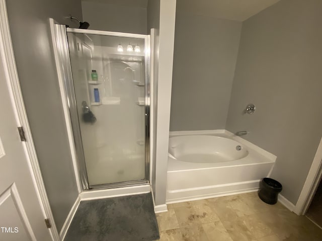 401 Lawton Dr, Haw River, NC 27258 - full bath with a shower stall, a bath, and baseboards