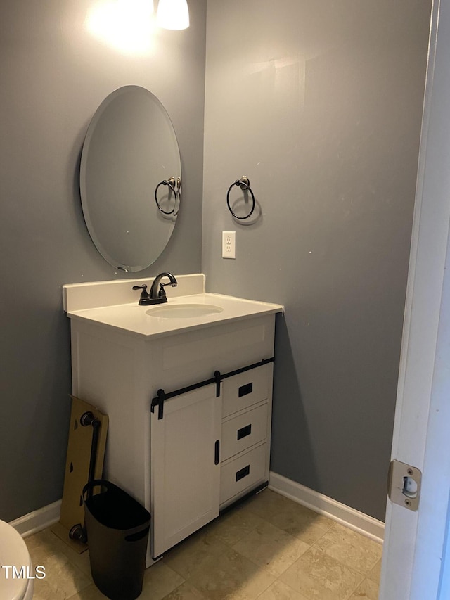 401 Lawton Dr, Haw River, NC 27258 - half bath featuring vanity, toilet, and baseboards