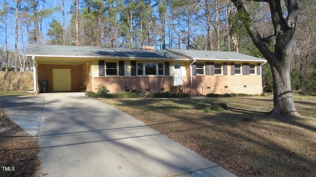 ranch-style house featuring a carport and a front lawn